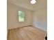 Bright bedroom features neutral walls and light wood-look floors at 2070 Stirewalt Rd, China Grove, NC 28023