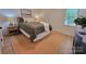 Inviting bedroom featuring a comfortable bed, bedside tables, and warm lighting for a relaxed ambiance at 2070 Stirewalt Rd, China Grove, NC 28023