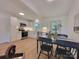 Well-lit kitchen featuring white cabinetry, stainless steel appliances, and adjacent dining area for convenient meals at 2070 Stirewalt Rd, China Grove, NC 28023