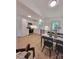 Bright kitchen featuring sleek white cabinets, stainless steel appliances, and a dining space with modern furnishings at 2070 Stirewalt Rd, China Grove, NC 28023