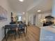Inviting living and dining area showcasing modern flooring, a dining set, and seamless flow into the kitchen at 2070 Stirewalt Rd, China Grove, NC 28023