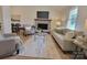 Cozy living room featuring a brick fireplace, neutral color scheme, and comfortable seating arrangement at 2070 Stirewalt Rd, China Grove, NC 28023