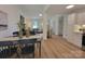 Bright open-concept living and dining area featuring updated floors and a view of the cozy living space at 2070 Stirewalt Rd, China Grove, NC 28023