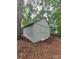 A large shed is nestled among the trees with a neutral tone and double doors at 2070 Stirewalt Rd, China Grove, NC 28023