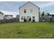 Spacious backyard with a wood fence, offering privacy for outdoor activities at 211 Hidden Lakes Rd, Statesville, NC 28677