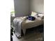 Bedroom with neutral walls, a window with blinds, and a plant for added charm at 211 Hidden Lakes Rd, Statesville, NC 28677