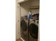 Modern laundry room featuring front load washer and dryer at 211 Hidden Lakes Rd, Statesville, NC 28677
