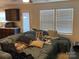 Bright living room with large windows and comfortable seating, perfect for relaxation at 211 Hidden Lakes Rd, Statesville, NC 28677
