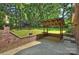 Backyard patio with an outdoor structure and string lights, perfect for outdoor entertaining at 2301 Seth Thomas Rd, Charlotte, NC 28210