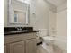 Bathroom with vanity and decorative mirror, tiled shower over bathtub, and neutral walls at 2301 Seth Thomas Rd, Charlotte, NC 28210