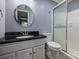 Bathroom featuring a black granite sink top, a white sink, and a glass shower enclosure at 2301 Seth Thomas Rd, Charlotte, NC 28210