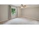 Bedroom featuring neutral carpet, a ceiling fan, and a window with natural light at 2301 Seth Thomas Rd, Charlotte, NC 28210
