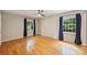 Spacious bedroom with hardwood floors, natural light through two windows, and neutral wall color at 2301 Seth Thomas Rd, Charlotte, NC 28210