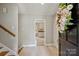 Bright foyer with tile flooring and views into the kitchen and other living spaces at 2301 Seth Thomas Rd, Charlotte, NC 28210