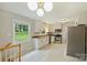 Modern kitchen with white cabinets, stainless steel appliances, granite countertops and bright natural lighting at 2301 Seth Thomas Rd, Charlotte, NC 28210