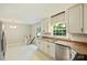 Modern kitchen area with granite counters, stainless appliances and a separate dining area at 2301 Seth Thomas Rd, Charlotte, NC 28210