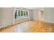 Spacious living room boasting hardwood floors, natural light, and a view of the front yard at 2301 Seth Thomas Rd, Charlotte, NC 28210