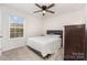 Bedroom with neutral walls, ceiling fan and natural light from a window, creating a peaceful retreat at 2317 Trollinger Dr, Catawba, NC 28609