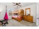 Bedroom with bunk bed, dresser, and a pink hammock swing creating a fun and cozy space at 2317 Trollinger Dr, Catawba, NC 28609