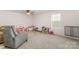 Bright bonus room with ample space for playing and relaxing. Featuring neutral paint, carpet, and a window at 2317 Trollinger Dr, Catawba, NC 28609