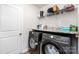 Laundry room with modern washer and dryer, granite countertops, shelving for storage at 2317 Trollinger Dr, Catawba, NC 28609