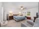 The main bedroom includes a ceiling fan, neutral walls, and a comfortable bed with cozy furnishings at 2317 Trollinger Dr, Catawba, NC 28609