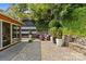 A view of the home's backyard, showcasing lush landscaping and an outdoor seating area at 2424 Cumberland Ave, Charlotte, NC 28203