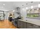 Well-lit kitchen showcasing stainless steel appliances, granite countertops, and modern design at 2424 Cumberland Ave, Charlotte, NC 28203