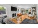 Bright living room featuring a fireplace, hardwood floors, and an open-concept design at 2424 Cumberland Ave, Charlotte, NC 28203