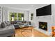 Inviting living room with a fireplace, comfortable seating, and ample natural light at 2424 Cumberland Ave, Charlotte, NC 28203