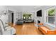 Cozy living room with hardwood floors, fireplace, gray sofa, and natural light at 2424 Cumberland Ave, Charlotte, NC 28203