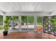 Sunroom featuring sliding glass doors leading to a private backyard patio and ample natural light at 2424 Cumberland Ave, Charlotte, NC 28203