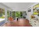Bright and airy sunroom with walls of windows, decorative tile floor, and modern decor, ideal for indoor-outdoor living at 2424 Cumberland Ave, Charlotte, NC 28203