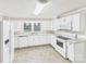 A kitchen with white cabinets and newer appliances at 271 Nc 16 N Hwy, Taylorsville, NC 28681