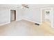 Bright living room featuring neutral walls and carpet, trimmed doorways, and a ceiling fan at 271 Nc 16 N Hwy, Taylorsville, NC 28681