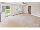 Neutral living room featuring a ceiling fan and a glass door with a view of the outdoors at 271 Nc 16 N Hwy, Taylorsville, NC 28681