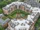 An aerial view showcases the condo's unique architecture and communal outdoor spaces from an elevated perspective at 300 W 5Th St # 339, Charlotte, NC 28202