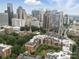 Expansive aerial view of urban condo with stunning city skyline backdrop and manicured courtyard at 300 W 5Th St # 339, Charlotte, NC 28202