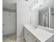 Bathroom features a large mirror and vanity with modern fixtures and lighting at 300 W 5Th St # 339, Charlotte, NC 28202