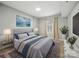 A cozy bedroom with a decorative rug, artwork, and ample natural light at 300 W 5Th St # 339, Charlotte, NC 28202