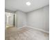 Empty carpeted bedroom with a view to a hallway and another room at 300 W 5Th St # 339, Charlotte, NC 28202