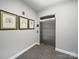 Hallway featuring an elevator, carpeted floor and framed artwork on the wall at 300 W 5Th St # 339, Charlotte, NC 28202