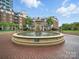 Circular fountain with water feature in the central courtyard of luxury apartment complex at 300 W 5Th St # 339, Charlotte, NC 28202