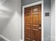 Unit entrance features a wooden door with modern electronic lock and unit number at 300 W 5Th St # 339, Charlotte, NC 28202