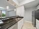Open-concept kitchen featuring granite countertops, stainless steel appliances, and a breakfast bar at 300 W 5Th St # 339, Charlotte, NC 28202