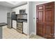 Well-lit kitchen featuring stainless steel appliances, white cabinets, and granite countertops at 300 W 5Th St # 339, Charlotte, NC 28202