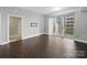 Bright living room featuring wood floors and sliding glass doors to a balcony at 300 W 5Th St # 339, Charlotte, NC 28202