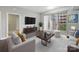 Contemporary living room featuring modern furniture, a large window, and a neutral color palette at 300 W 5Th St # 339, Charlotte, NC 28202