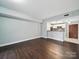 Spacious living room with wood floors open to the kitchen breakfast bar at 300 W 5Th St # 339, Charlotte, NC 28202