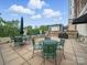 Spacious patio with dining tables, chairs, umbrella and barbecue grill, great for outdoor entertaining at 300 W 5Th St # 339, Charlotte, NC 28202